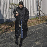 Yannette | Manteau long matelassé pour femme, avec col montant et coutures surpiquées