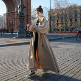 Théone | Manteau à coupe oversized pour femme, avec manches ballons et ceinture à la taille