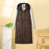 Kalinda | Gilet thermique long pour femme, matelassé, avec capuche et poches multifonctions