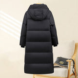 Jolande | Parka thermique matelassée extra-longue pour femme, avec capuche et poignets côtelés