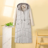 Kalinda | Gilet thermique long pour femme, matelassé, avec capuche et poches multifonctions