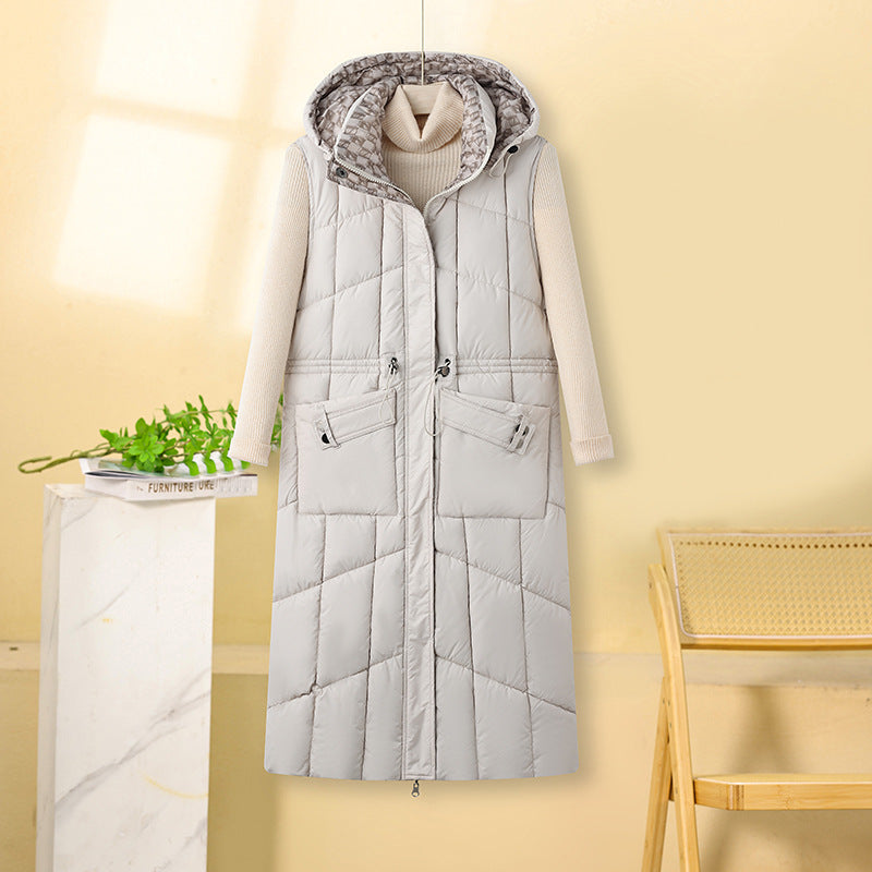 Kalinda | Gilet thermique long pour femme, matelassé, avec capuche et poches multifonctions