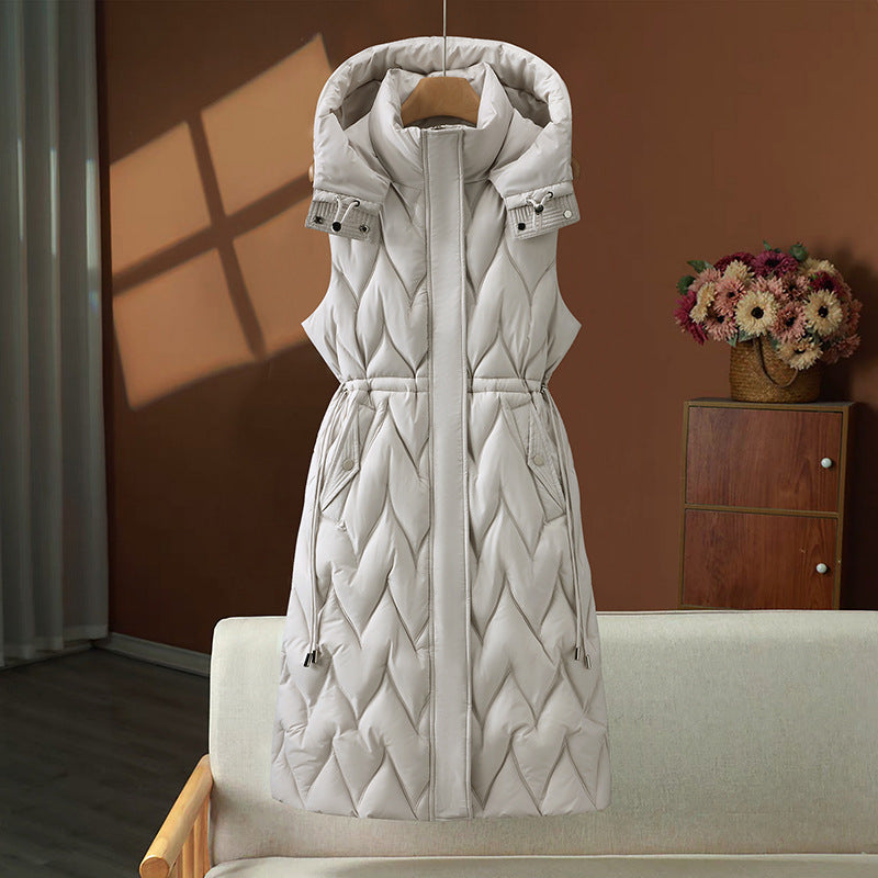 Olympe | Gilet long matelassé pour femme, avec capuche et cordon ajustable à la taille